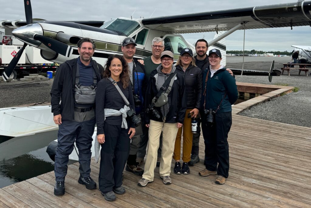 Students posing in front of plane before taking it into Lake Clark National Park on Summit's Alaska Photography workshop